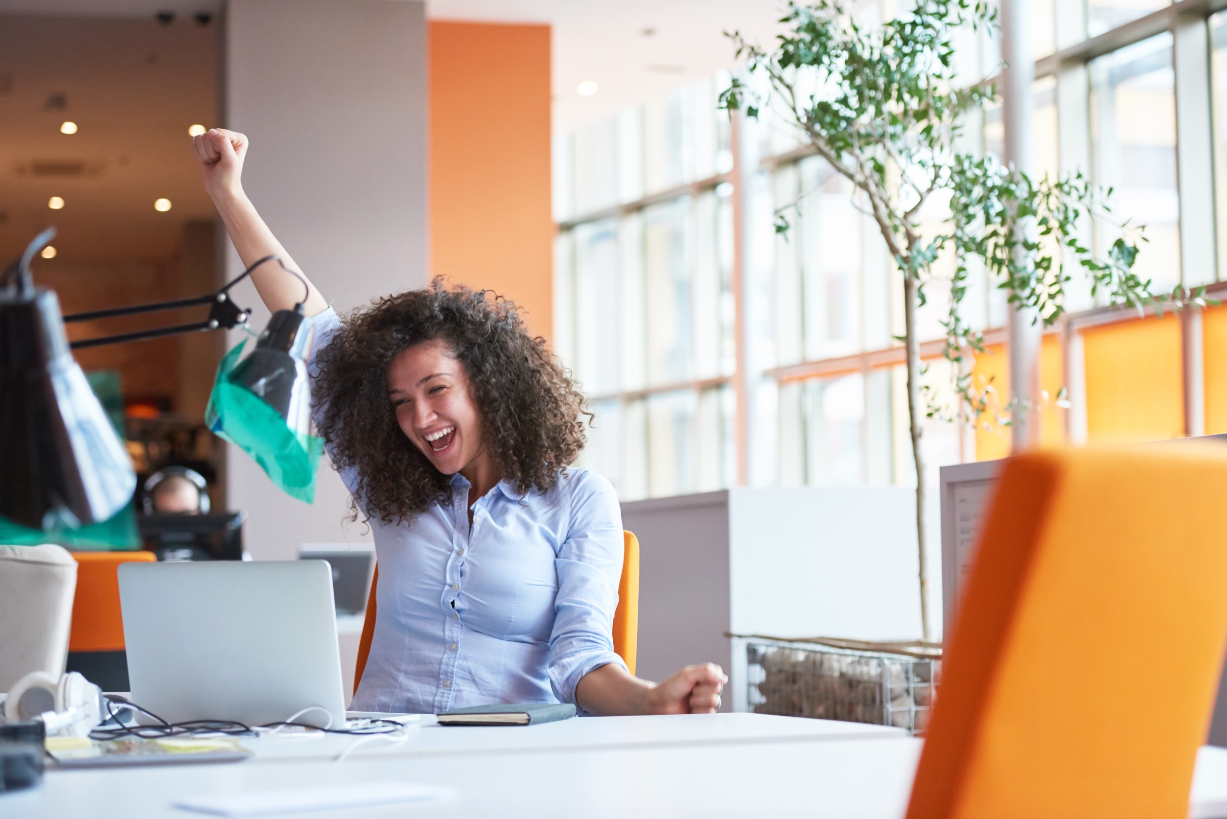 young woman happy at work